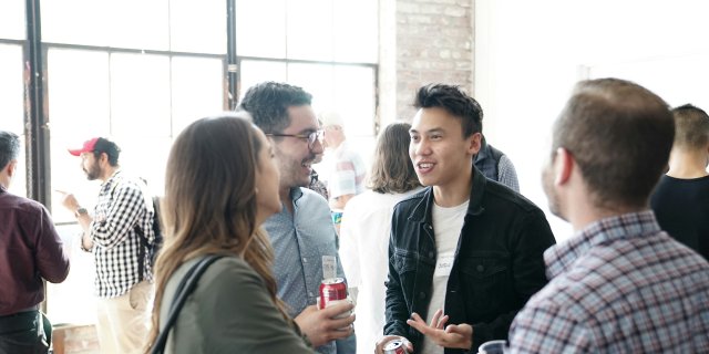Four people at a conference.