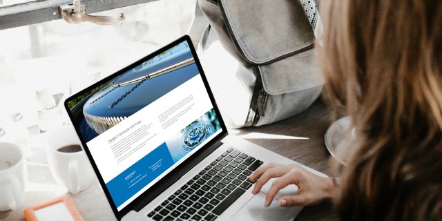 Woman working on a laptop.