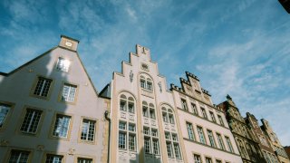 Yves Cedric Schulze | Unsplash Houses in Münster's old town centre.